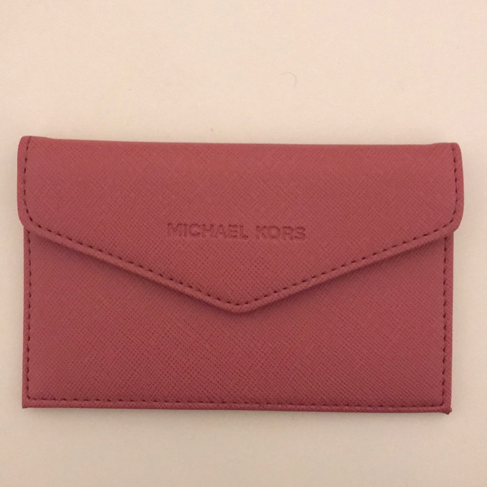 Authentic never used Michael Kors mini wallet